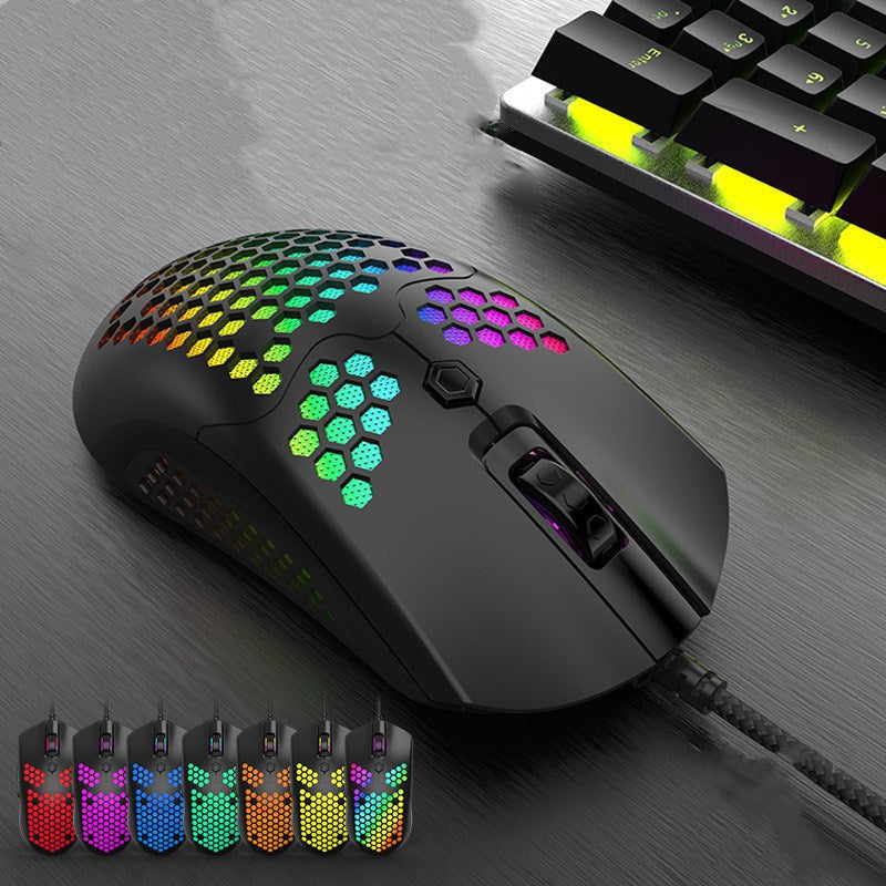 RGB wired gaming mouse with honeycomb shell in a clean desk setup