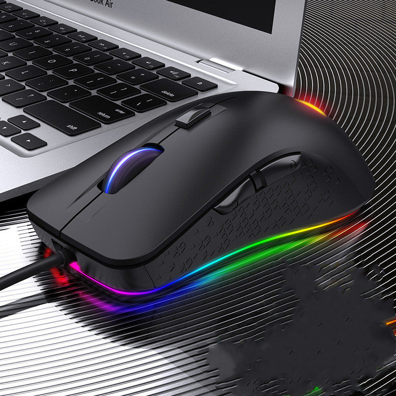 Black programmable RGB wired gaming mouse on a laptop setup