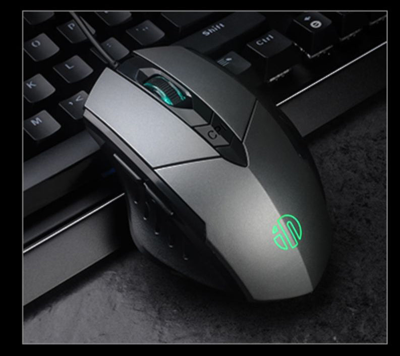 Black RGB wired gaming mouse on a clean desk setup