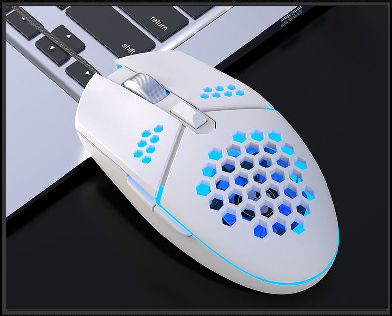 White vented RGB wired gaming mouse on a clean desk setup